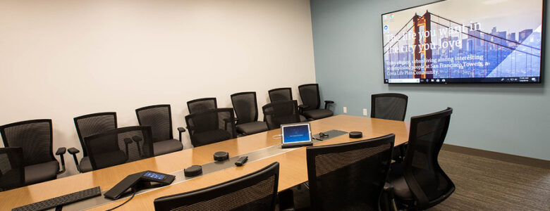 A conference room with a high-end large screen and a touch panel to control all AV and smart solutions.